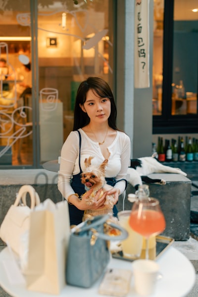 Expat pet owner enjoying coffee with dog at Lang Lang Don’t Cry café